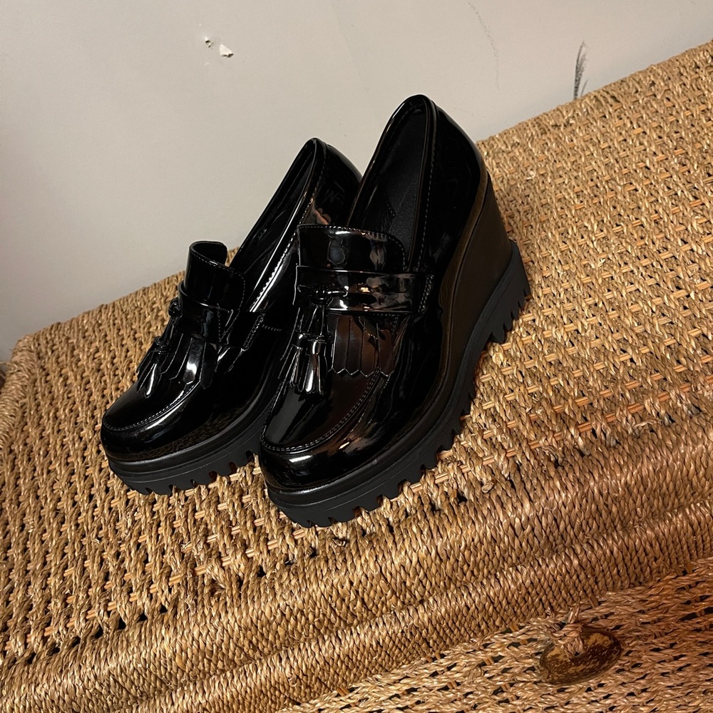 Black patent tassle wedge loafers